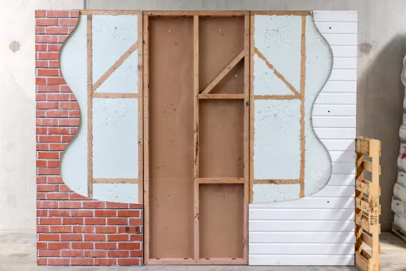 Does blown-in wall insulation settle over time?