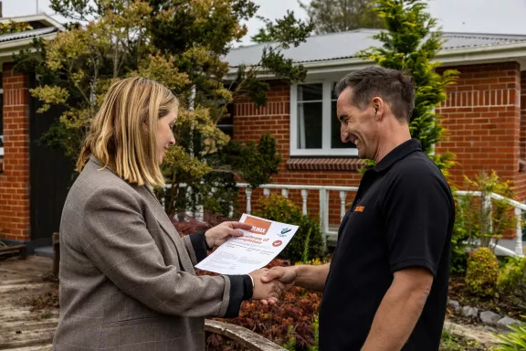 Do I need a building consent for wall insulation, and who arranges it?
